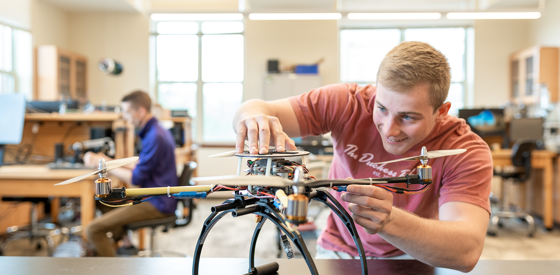 physics student using a drone 