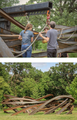 Nest sculpture being installed in the fields.