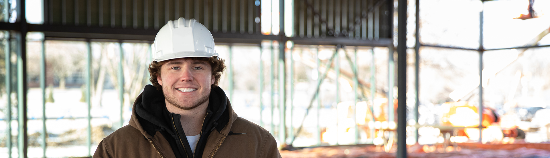 image of a construction management student in a hard hat 