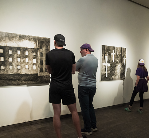 Visitors looking at art in the gallery 