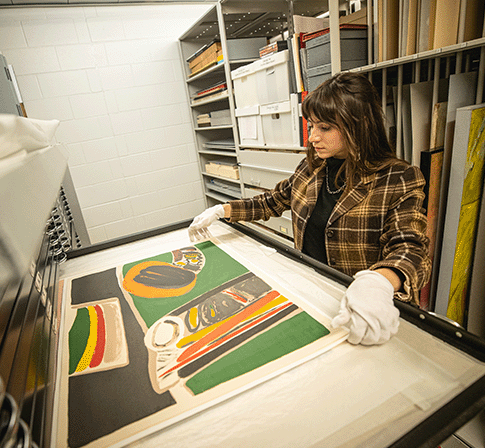 student working in the Gallery collections room