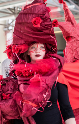 Lady in red dress and makeup.