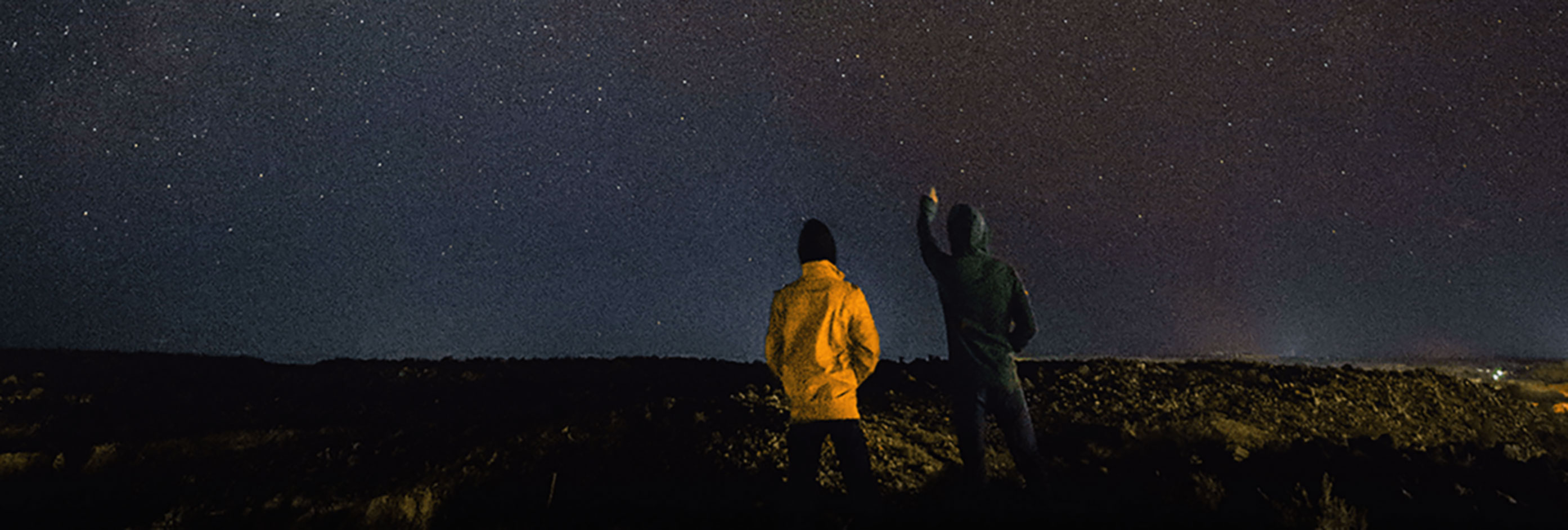two people looking at the stars