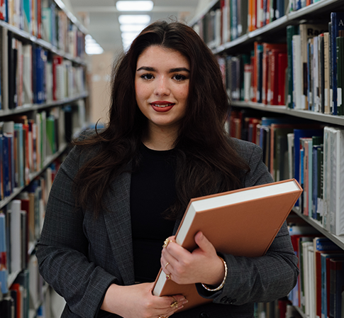 prelaw student holding a book