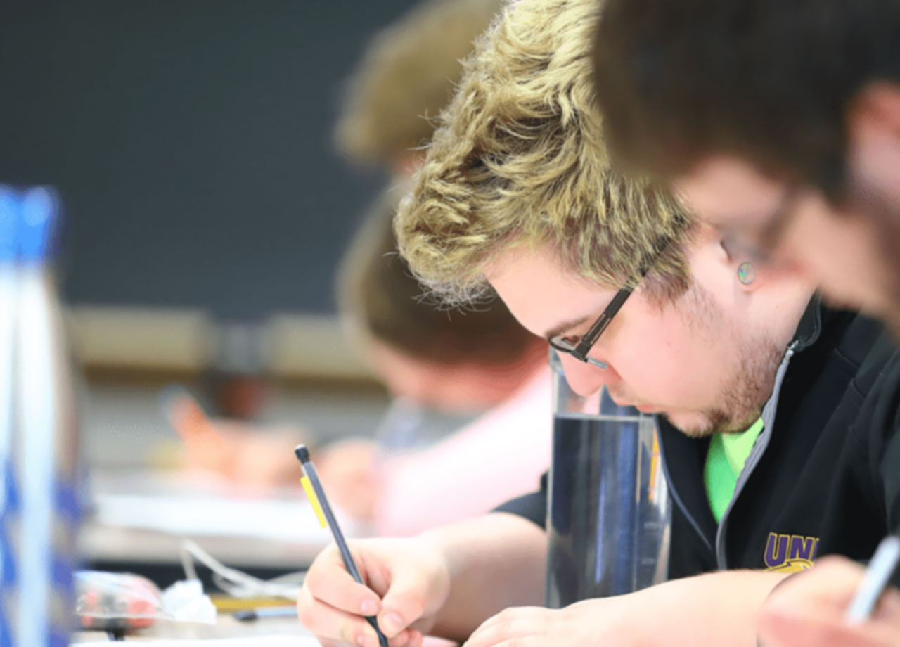 Students taking notes in class.