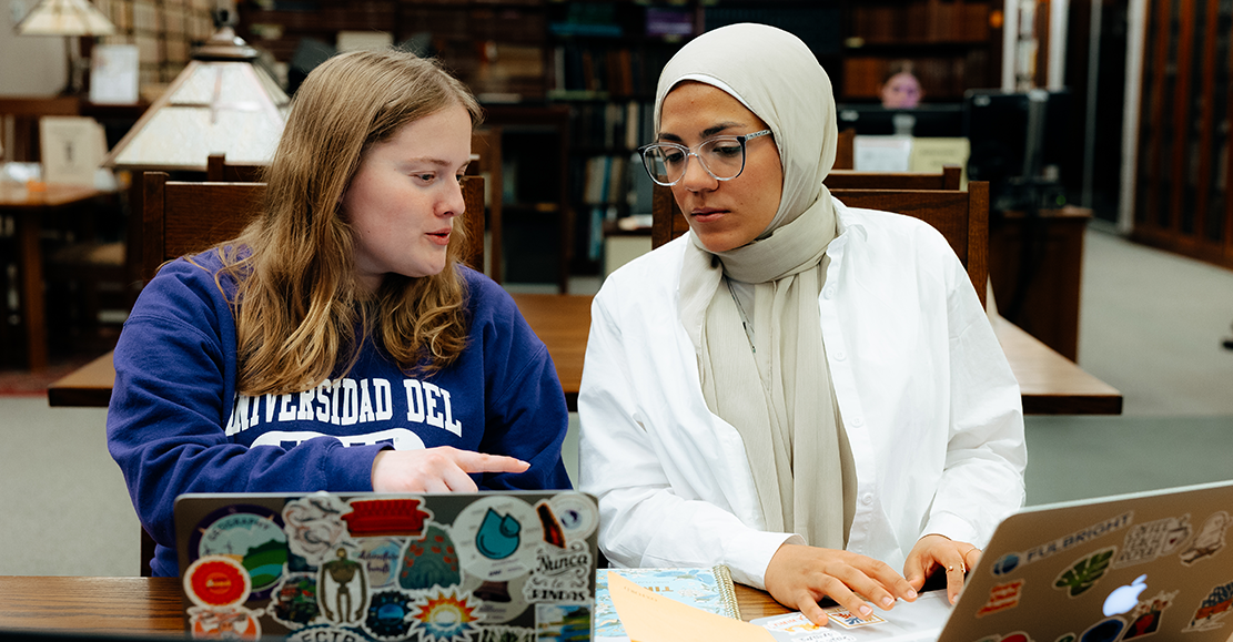 students in an English class talking to each other 