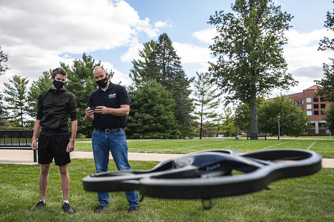 image of student using a drone