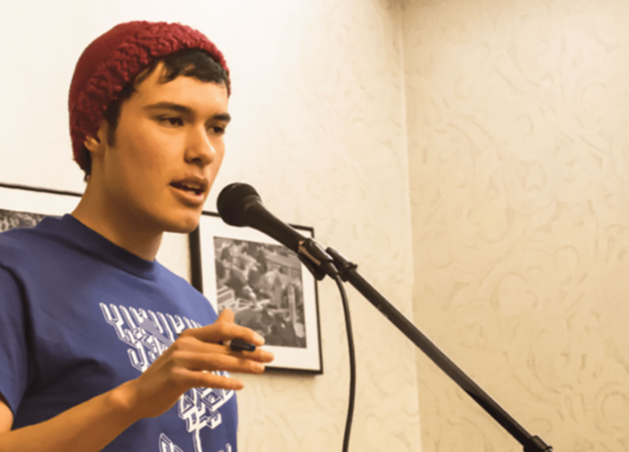 Student performing at an open mic.