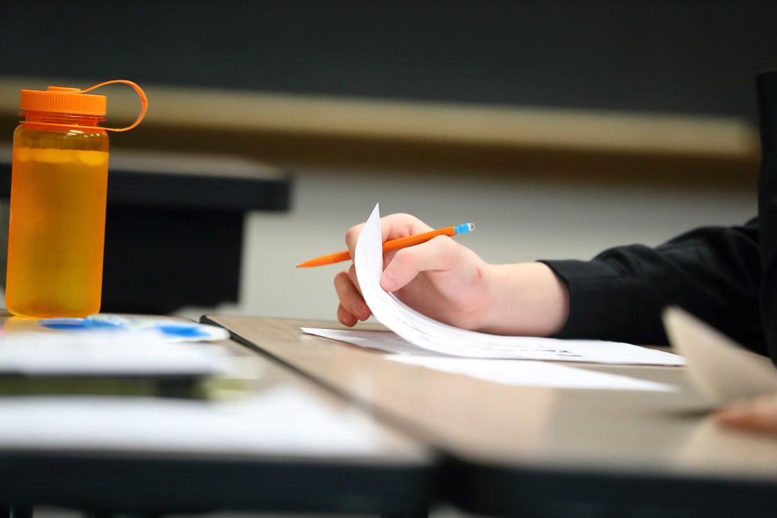 hand holding math paper