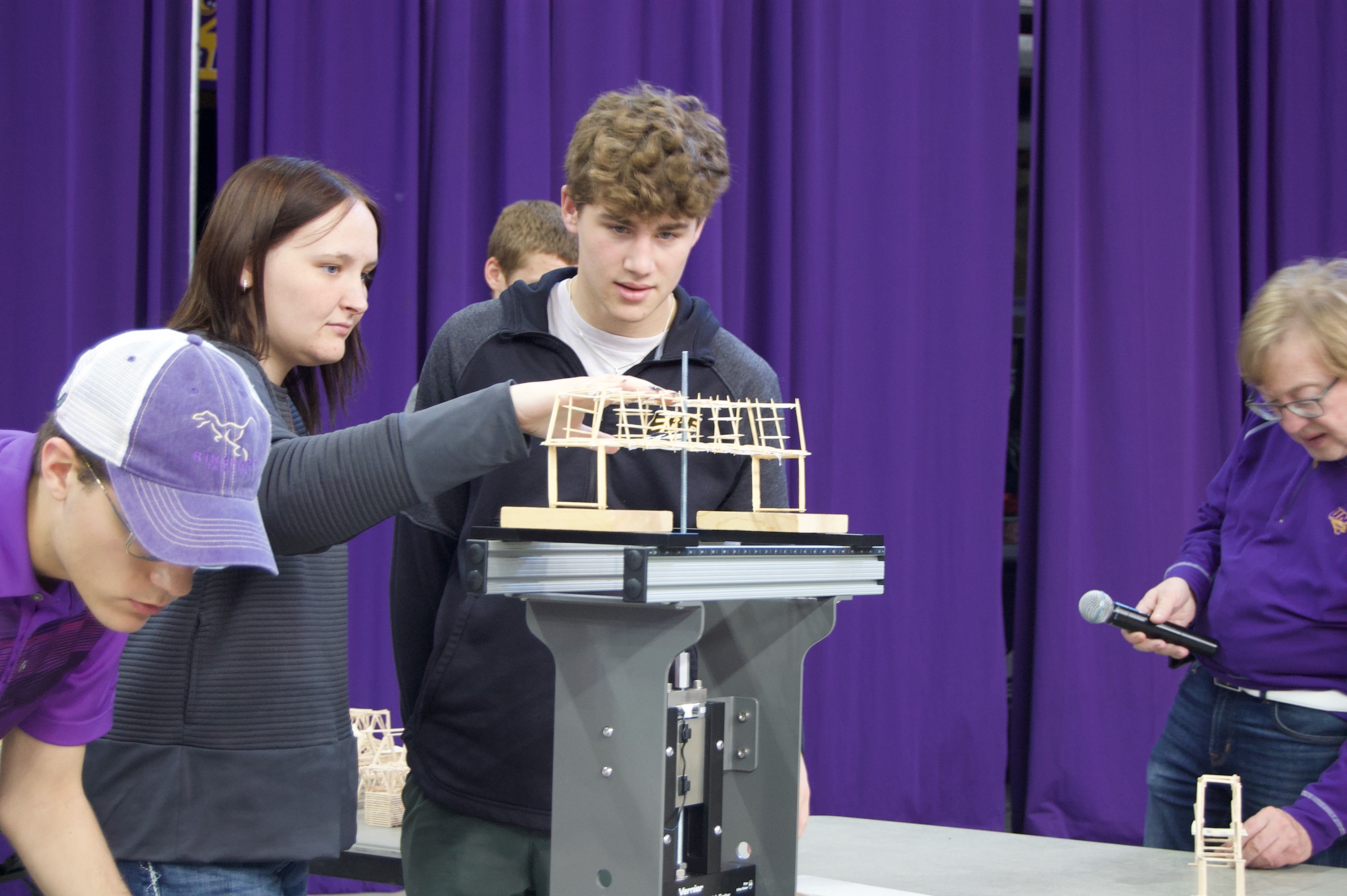 Two students working on an event at the Physics Competition.