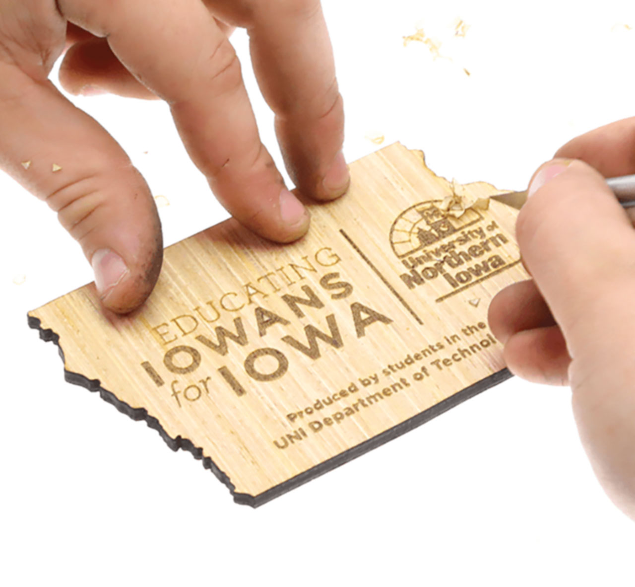 State of Iowa cutout with engraving on it.