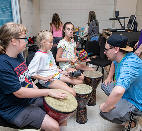 students working with youth in the Community Music School