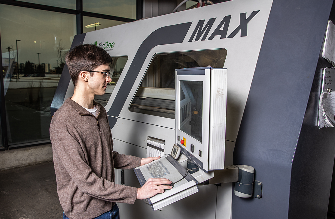 Student next to a MAX machine.