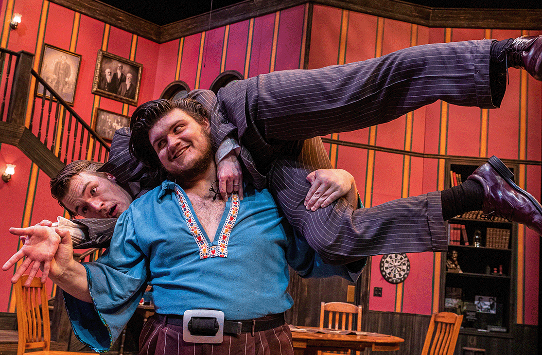 One actor hoists another up on their shoulders in TheatreUNI's production of You Can't Take it With You