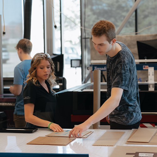 Two students working in a lab